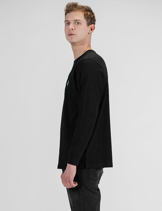 This is a black long-sleeve crewneck shirt with a small chest patch detail Rocket Science Longsleeve with Cuffrib.