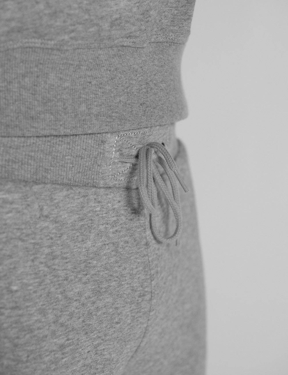 The image shows grey Rocket Science sweatpants with an elastic waistband and drawstring detail.