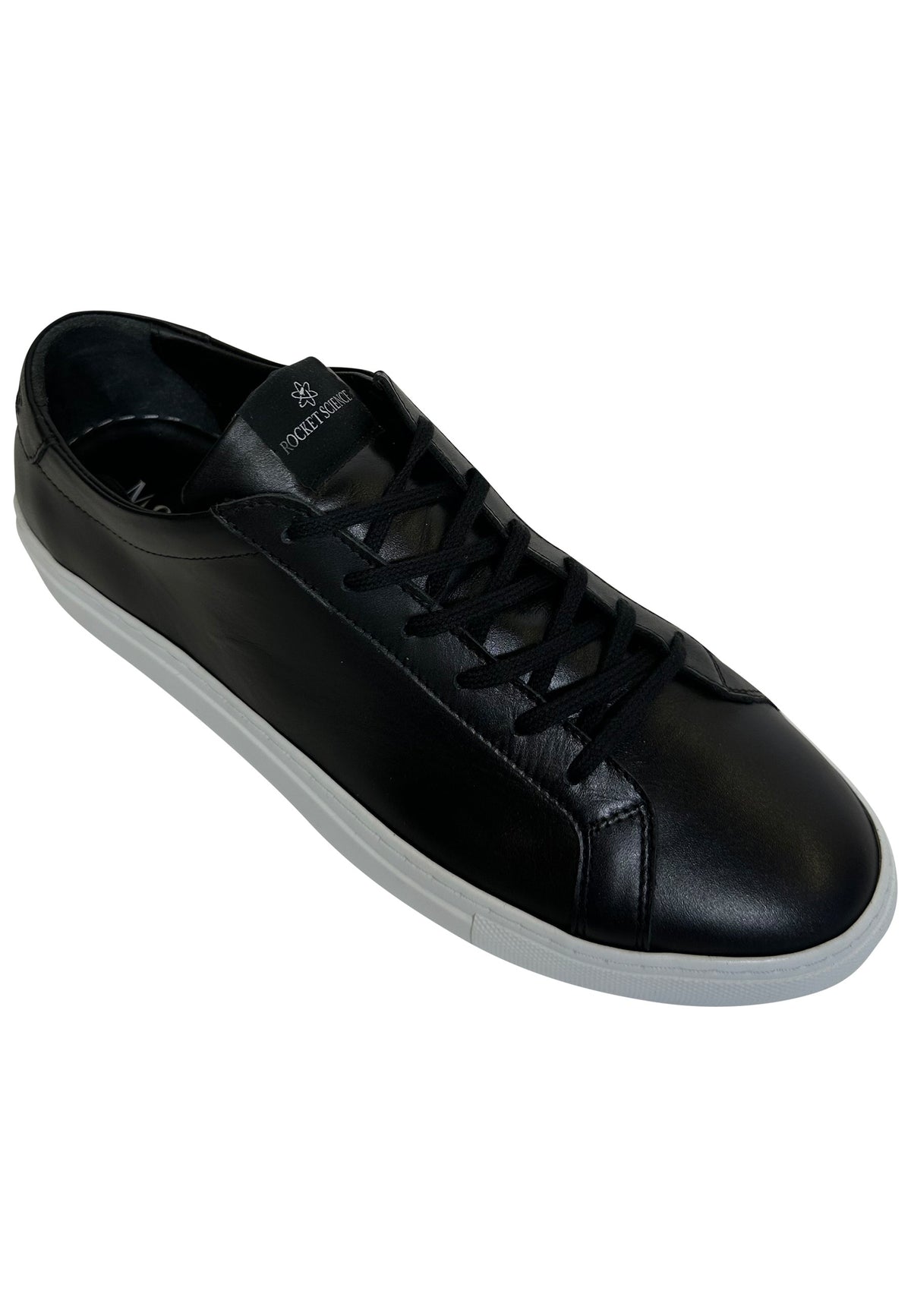 A single black leather sneaker with a low-top silhouette is shown angled toward the right against a solid white background. The sneaker features a smooth black leather upper, matching black laces, and a contrasting crisp white rubber sole. A small, subtle logo is visible on the top of the shoe's tongue.