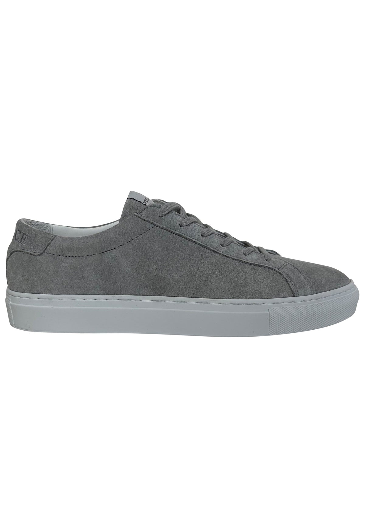 A gray suede minimalist low-top sneaker featuring a matching gray lace-up closure and a solid white rubber sole. A distinctive gray rectangular brand tag reading "ROCKETSCIENCE" is stitched onto the tongue of the shoe.