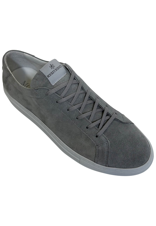 A gray suede minimalist low-top sneaker featuring a matching gray lace-up closure and a solid white rubber sole. A distinctive gray rectangular brand tag reading "ROCKETSCIENCE" is stitched onto the tongue of the shoe.
