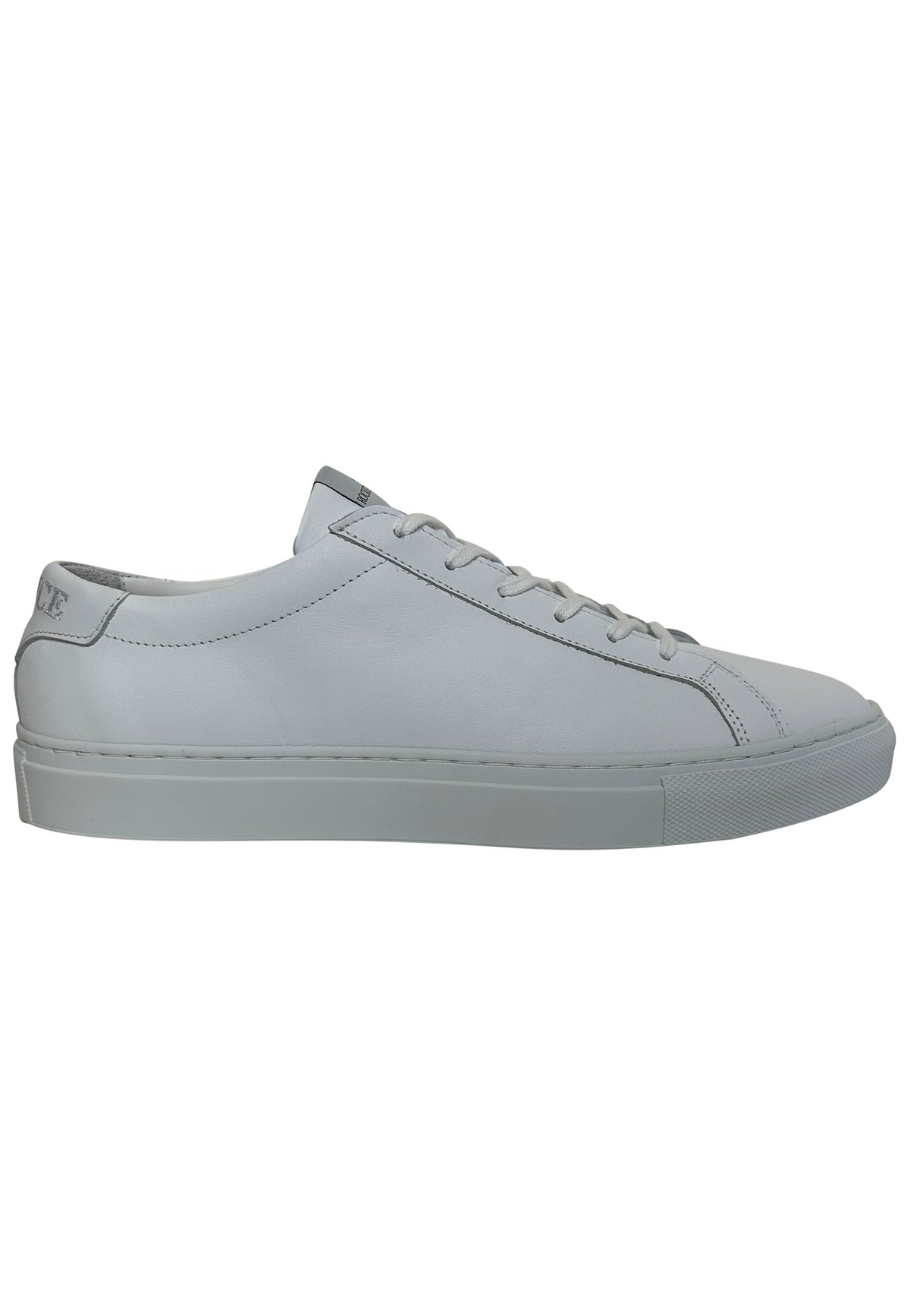 A light gray leather low-top sneaker with matching gray laces and a thick gray sole, shown in a side profile on a white background.