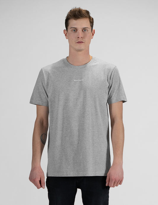 This image shows front pose of a man wearing a casual grey crew-neck t-shirt with a front print "Rocket Scientist", and dark denim jeans.