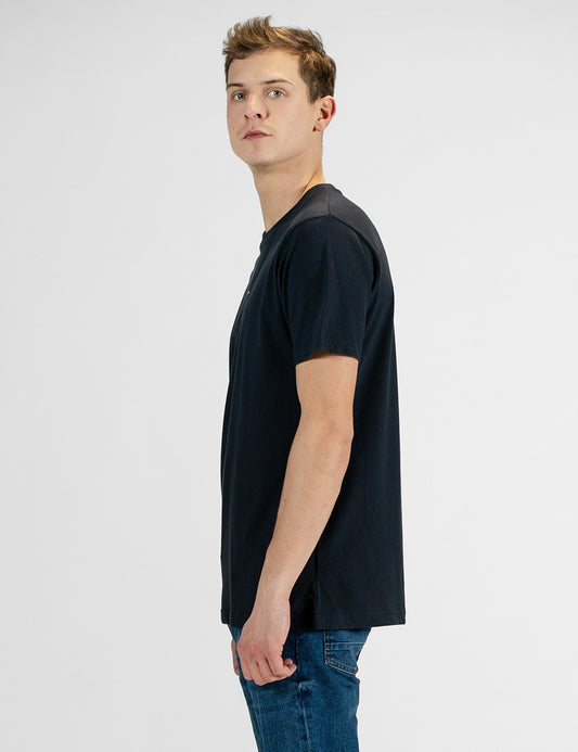 Navy blue crew neck t-shirt worn by male model side-view