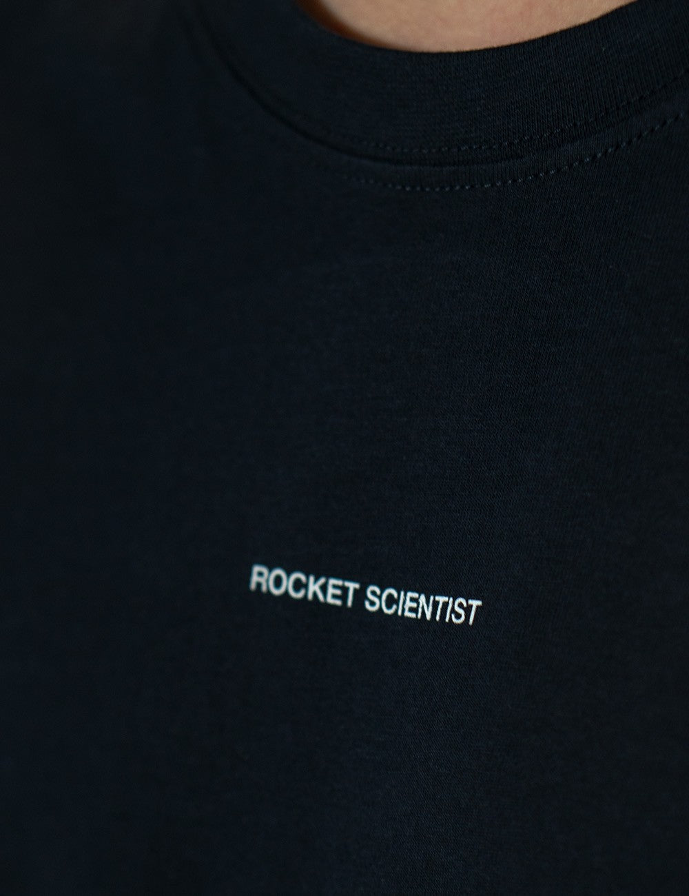 Navy round-neck T-shirt with the words 'Rocket Scientist' on the front.