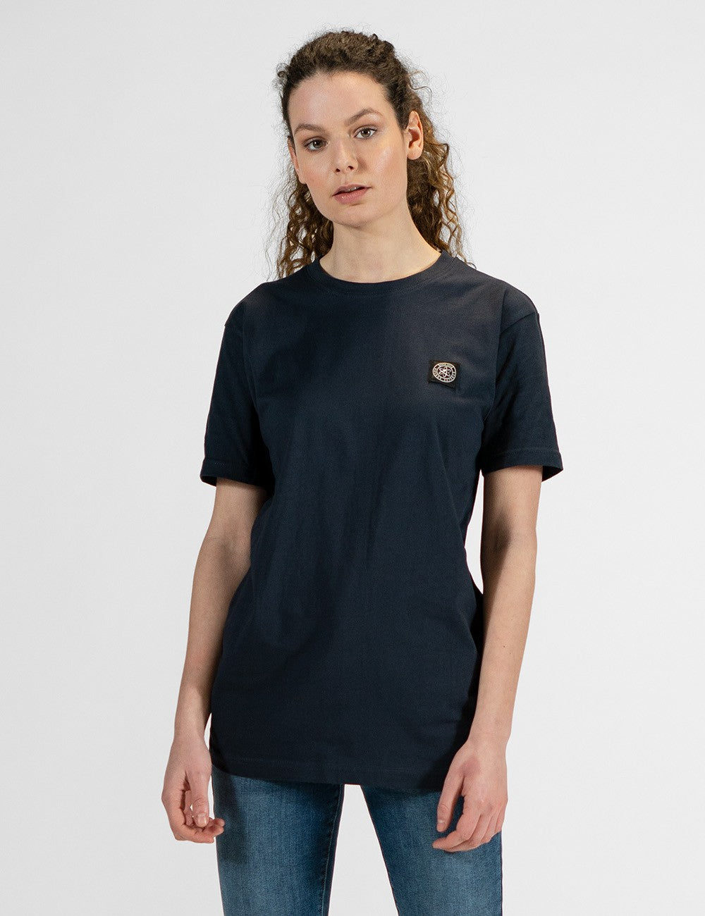 This image shows a front pose of a young woman,  wearing a basic navy blue short-sleeve crewneck t-shirt.